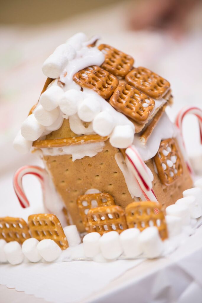 gingerbread house with pretzel roof - Christmas bucket list ideas