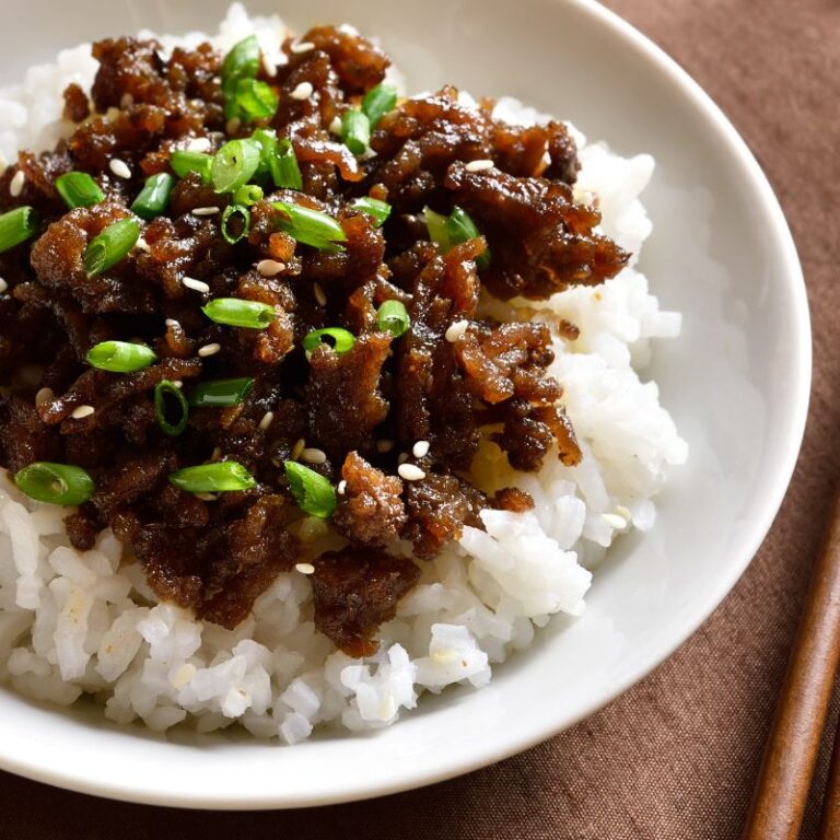 Asian food and white rice in white bowl
