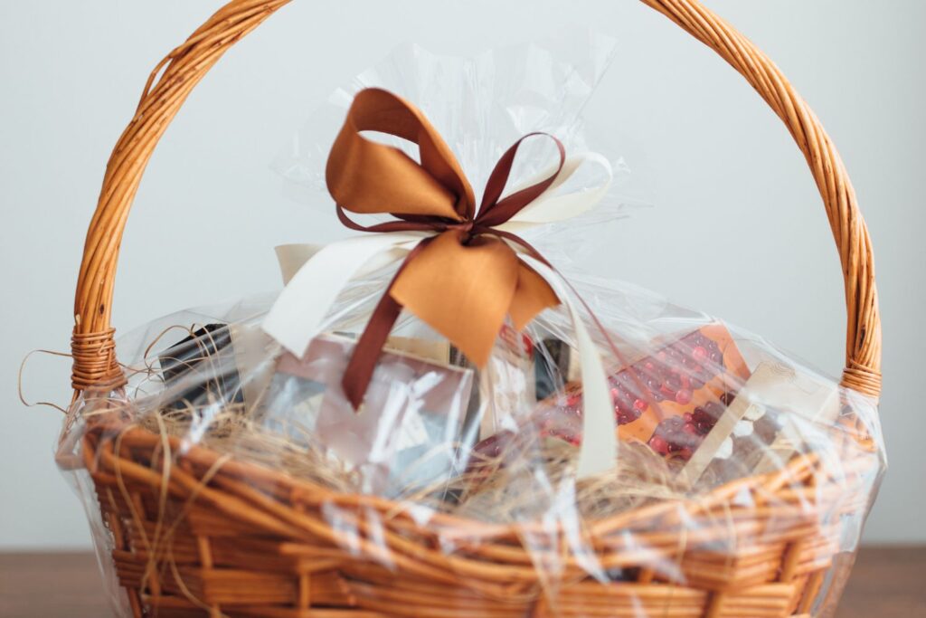 basket with brown ribbon filled with gifts