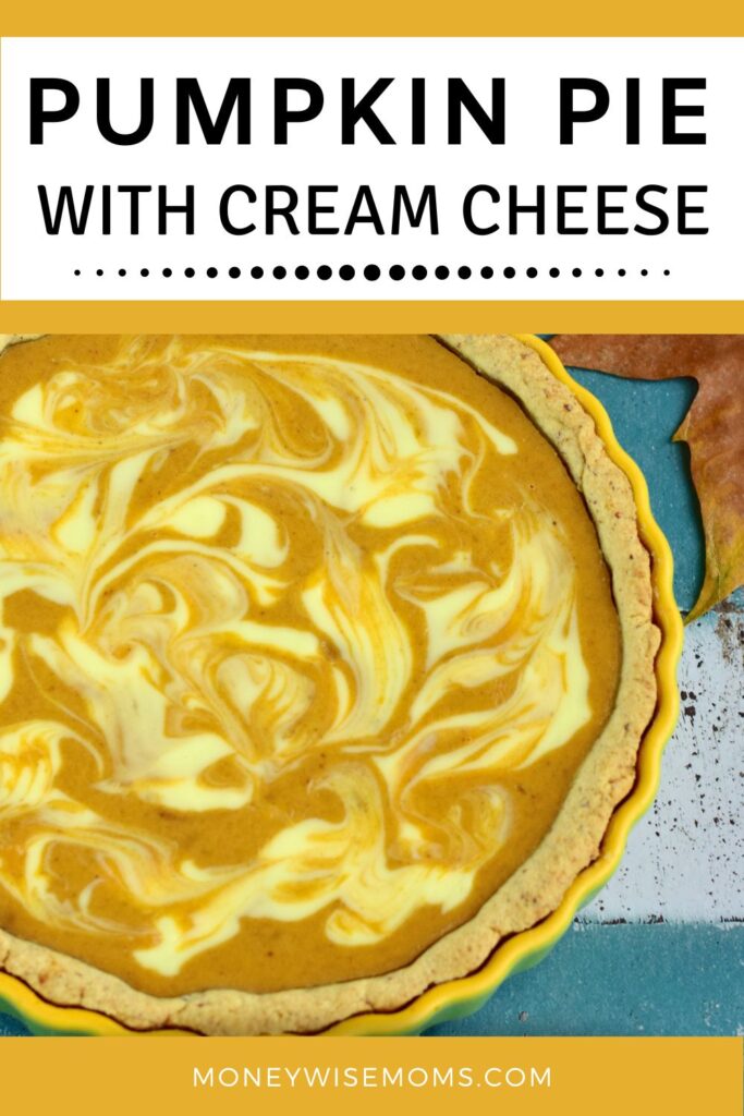 pumpkin pie with cream cheese swirl in yellow pie dish