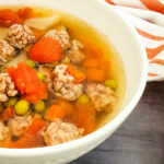 beef vegetable soup in white bowl