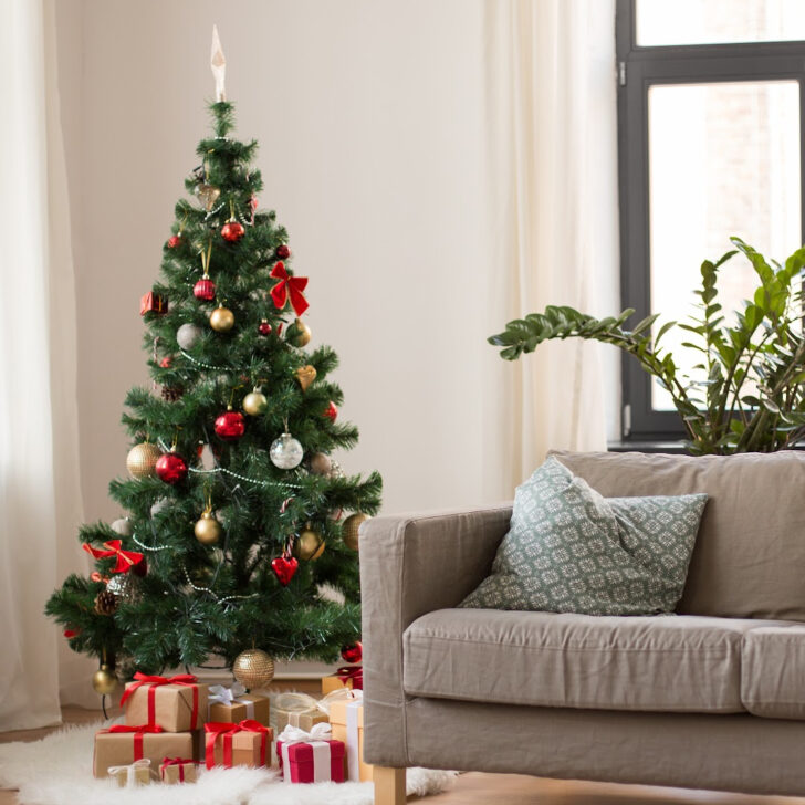 Christmas tree and gifts in neutral living room