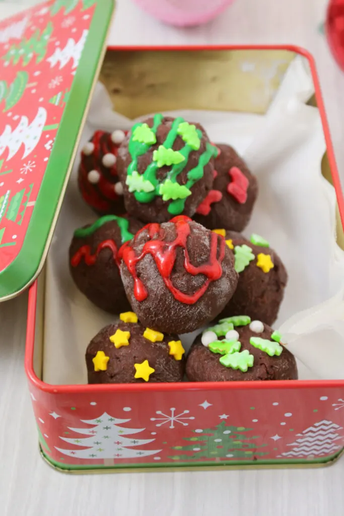 Holiday chocolate truffles in Christmas tin