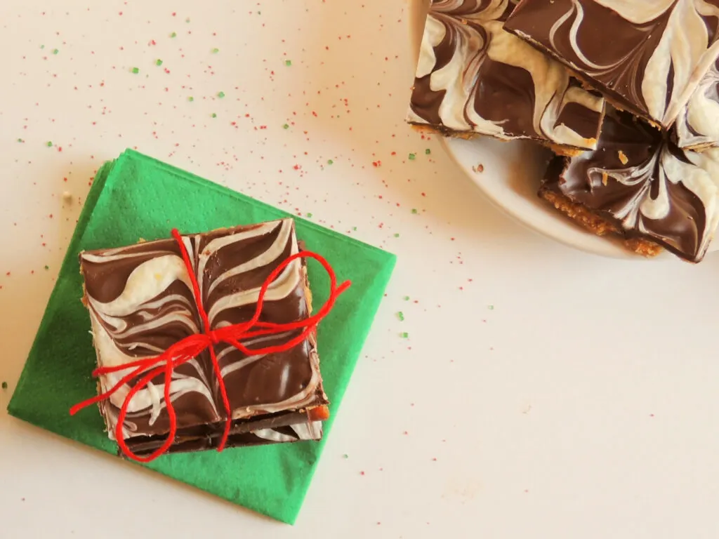 gift of toffee cracker candy tied with red ribbon