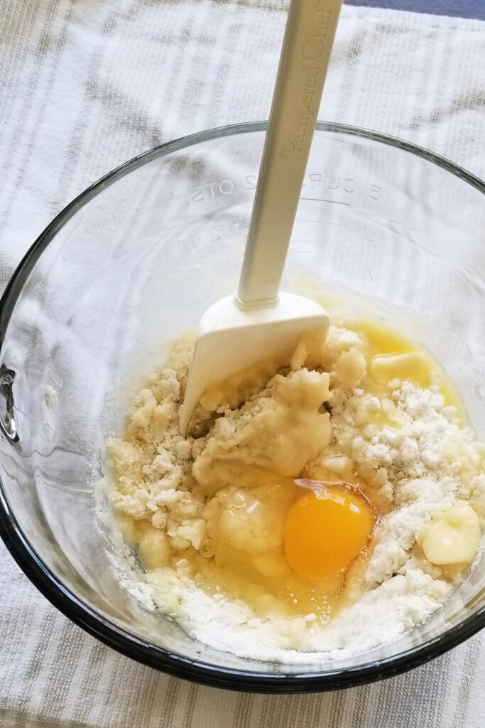 mixing cake mix with egg and butter