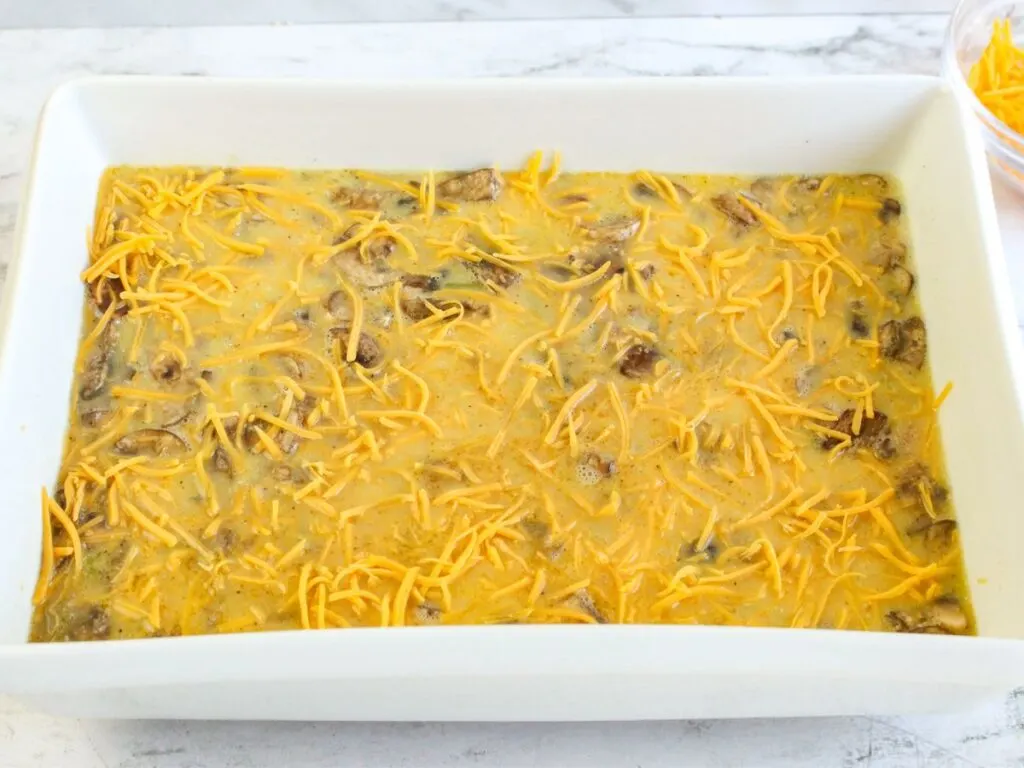 Cheese over egg mixture in casserole dish