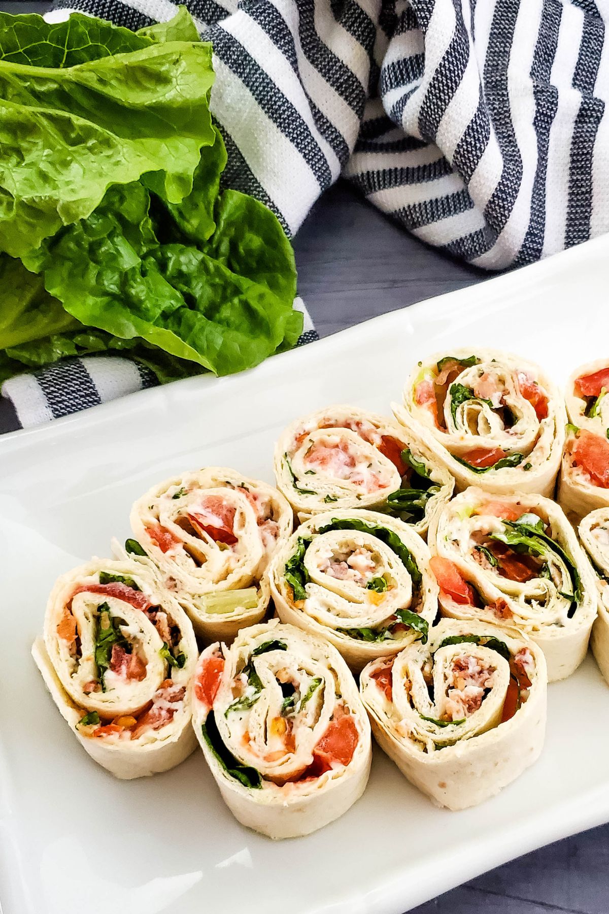 BLT pinwheels on rectangular white platter