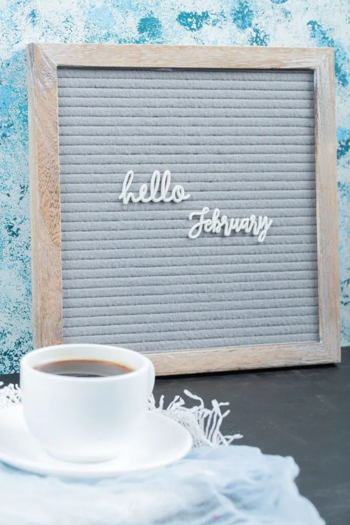 hello February on felt board with cup of coffee