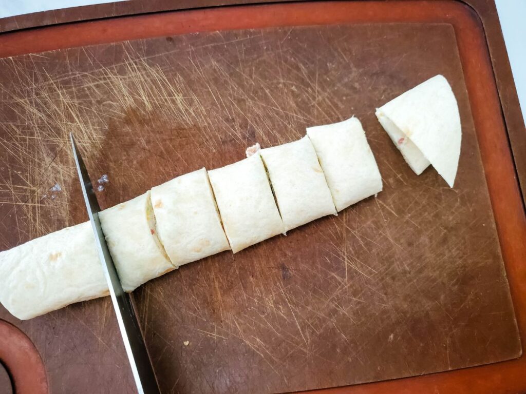 slicing jalapeno tortilla pinwheel appetizers