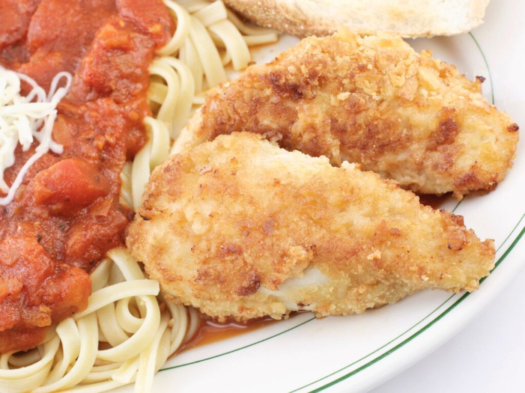 Parmesan crusted chicken with linguine and tomato sauce