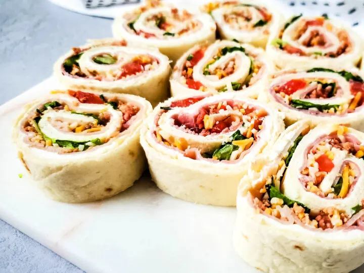 ham and turkey pinwheels with tomato lettuce and cheese