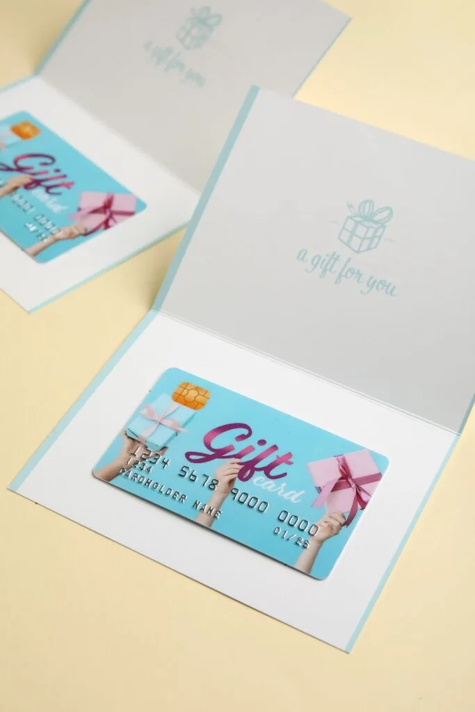 blue gift card in paper holder - ways to use gift cards