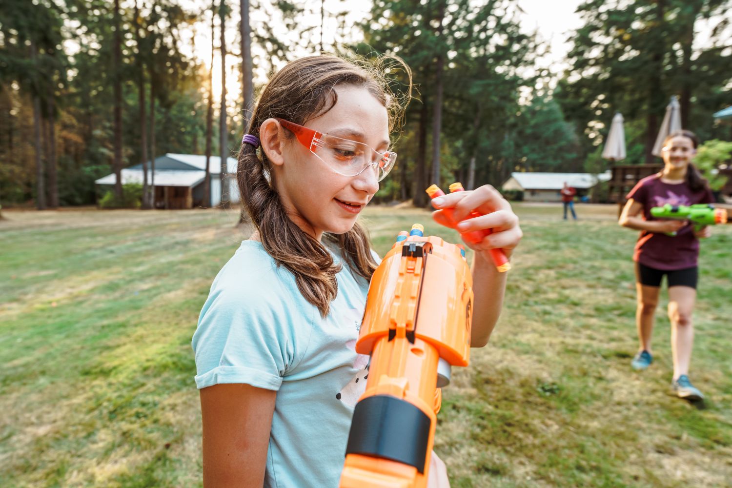 girl with nerf gun - summer activities for tweens