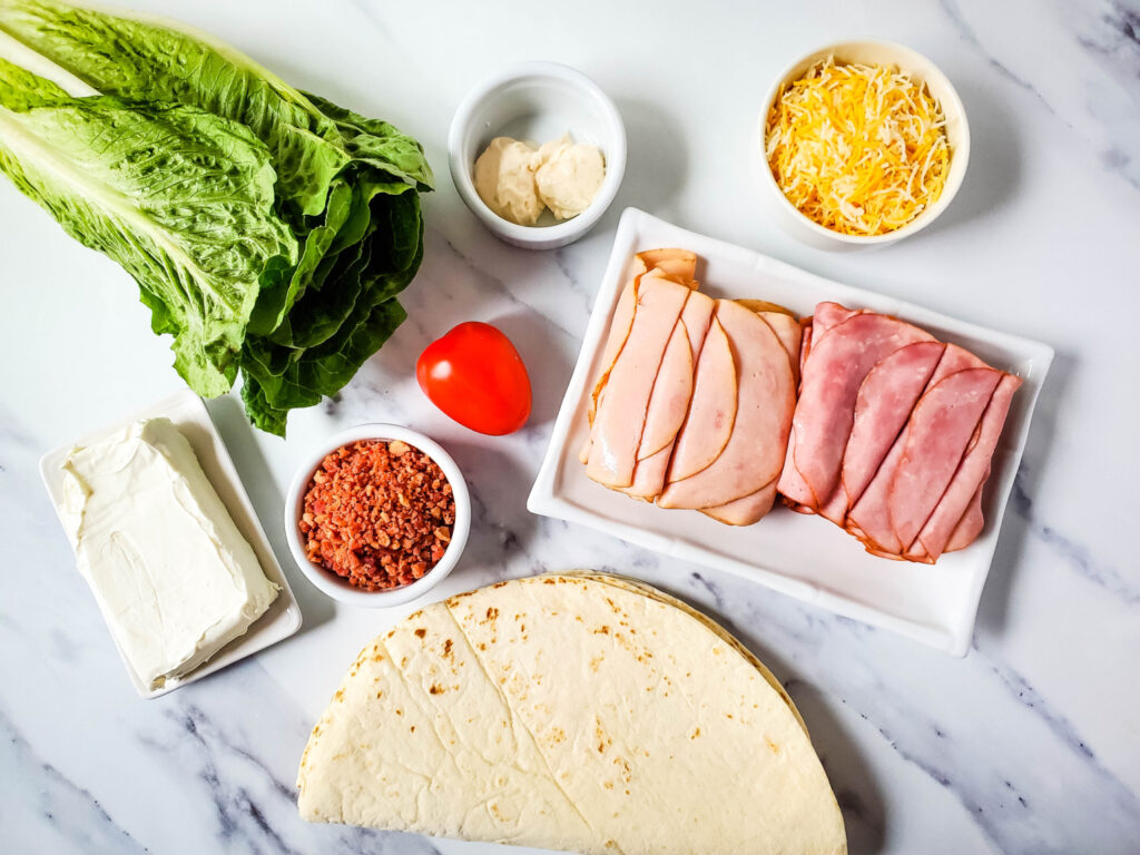ingredients to make ham and turkey pinwheel appetizers