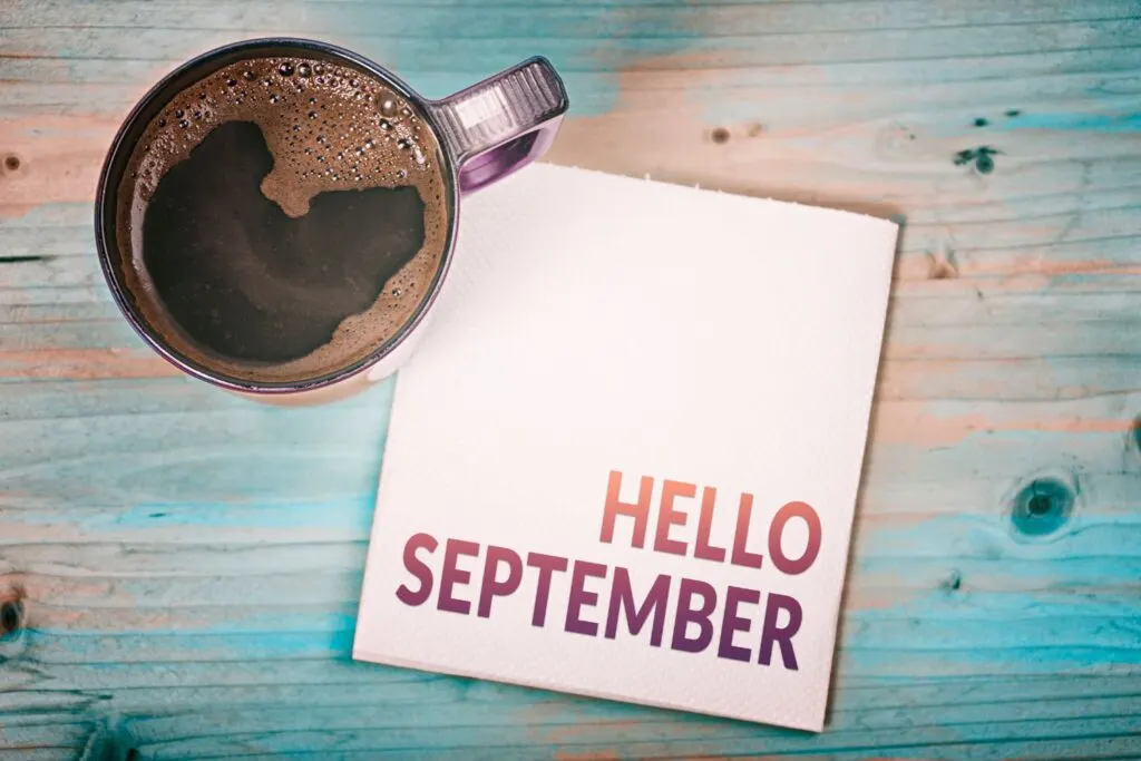 Hello September card with cup of coffee on blue wooden table