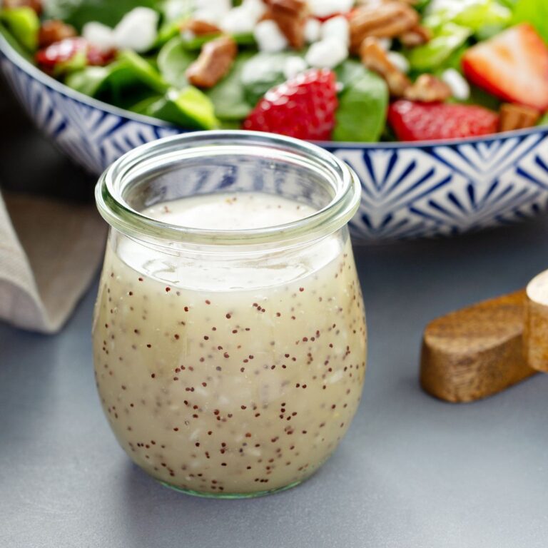 homemade poppy seed dressing in open glass jar