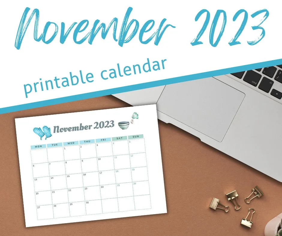 November printable calendar on brown desktop with laptop and gold binder clips