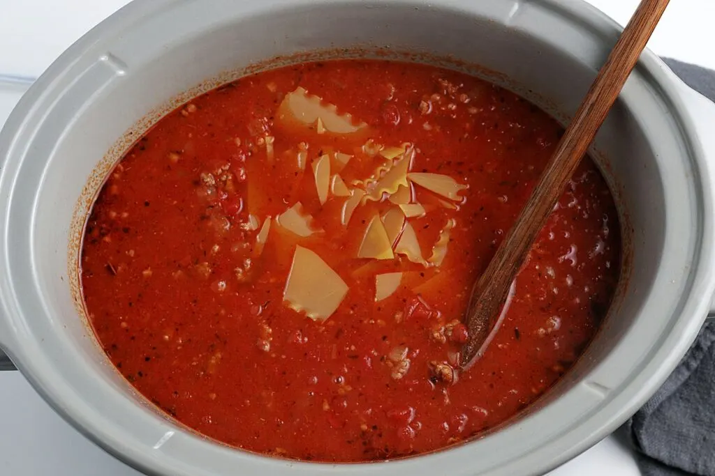 Stirring dry lasagna noodles into crock pot lasagna soup